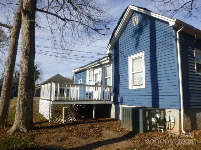 view of side of property with a deck