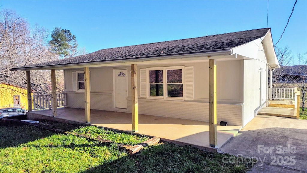 rear view of property featuring a patio