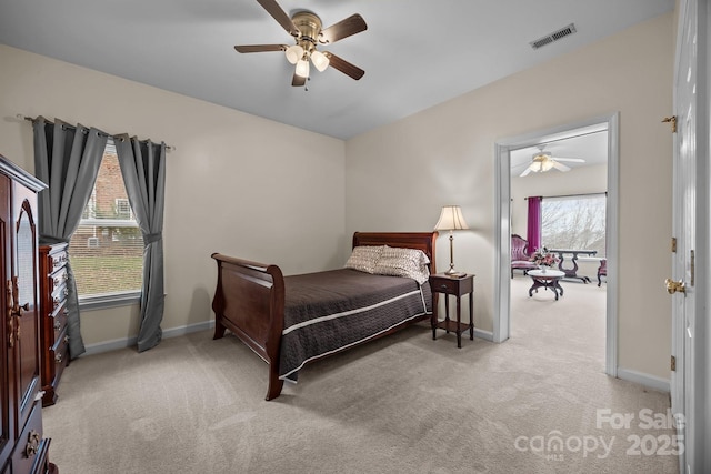 bedroom with light carpet and ceiling fan