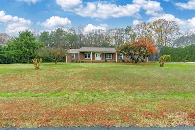 ranch-style house with a front yard