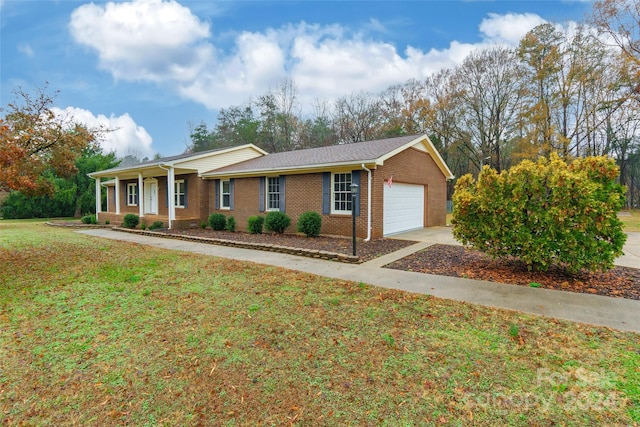 ranch-style house with a front lawn, covered porch, and a garage