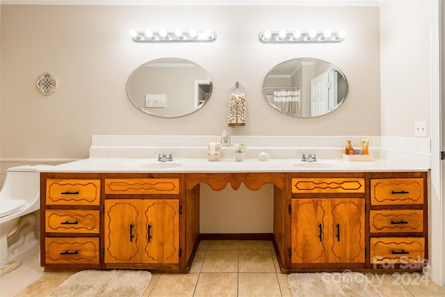 bathroom featuring tile patterned flooring, vanity, and toilet