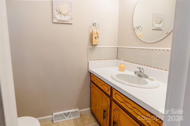 bathroom with tile patterned flooring and vanity