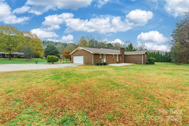 exterior space featuring a front lawn and a garage