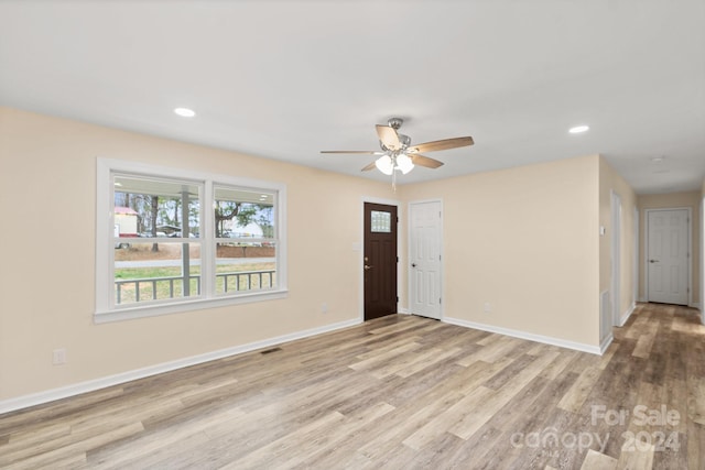 entrance foyer with ceiling fan and light hardwood / wood-style floors