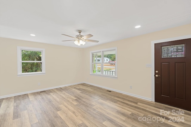 entryway featuring light wood-type flooring and ceiling fan