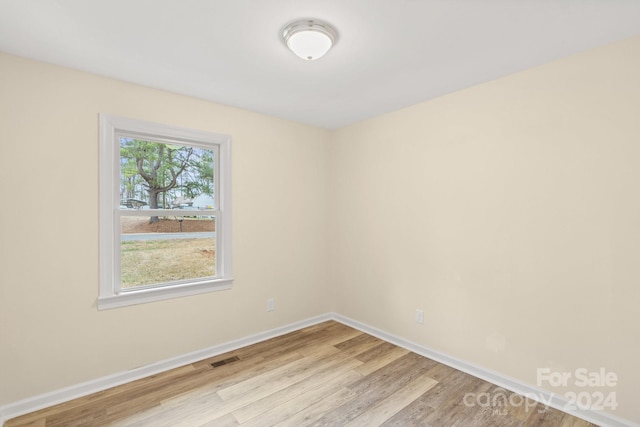 empty room with light wood-type flooring