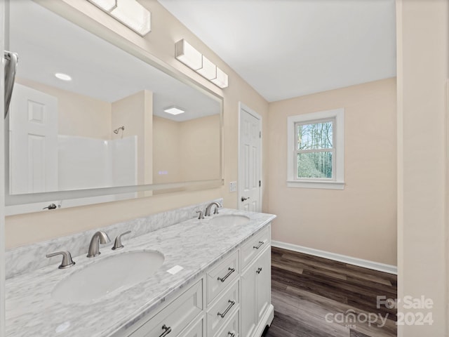 bathroom featuring hardwood / wood-style floors and vanity