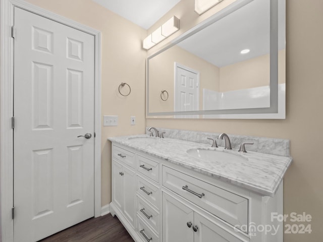 bathroom with hardwood / wood-style floors and vanity