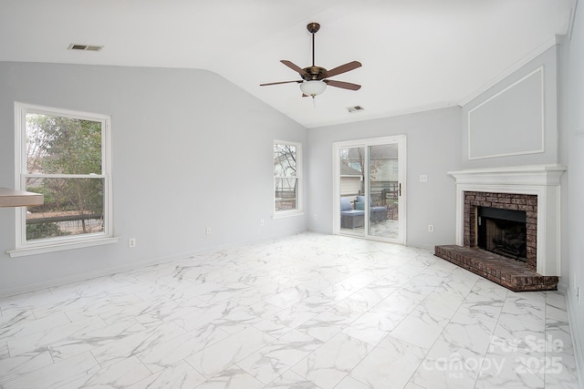 unfurnished living room with a fireplace, vaulted ceiling, and ceiling fan