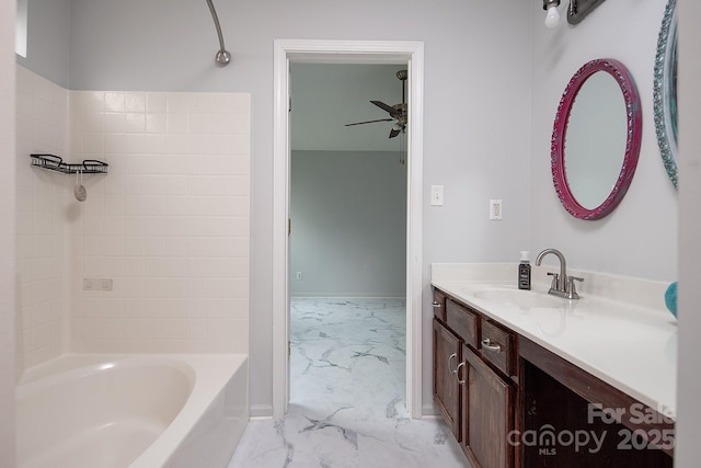 bathroom featuring bathing tub / shower combination, ceiling fan, and vanity