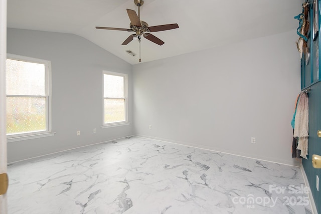 spare room with ceiling fan, lofted ceiling, and a wealth of natural light