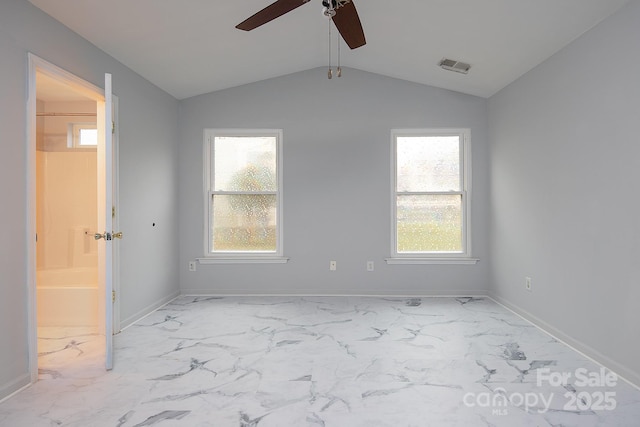 spare room with ceiling fan and lofted ceiling