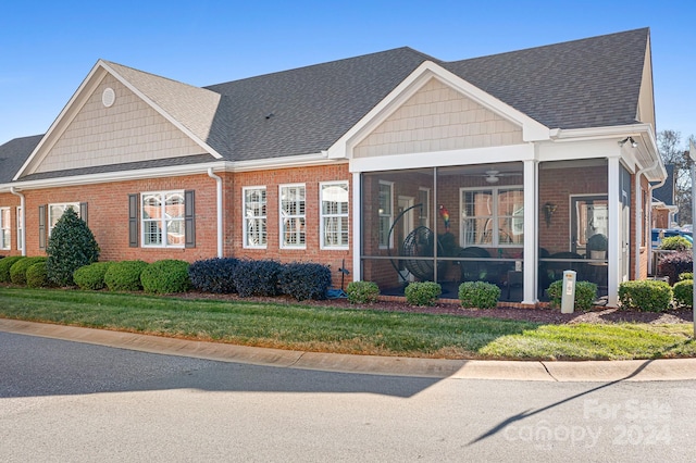 view of front of house featuring a sunroom