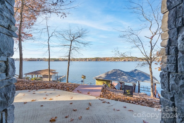 property view of water featuring a gazebo and a boat dock