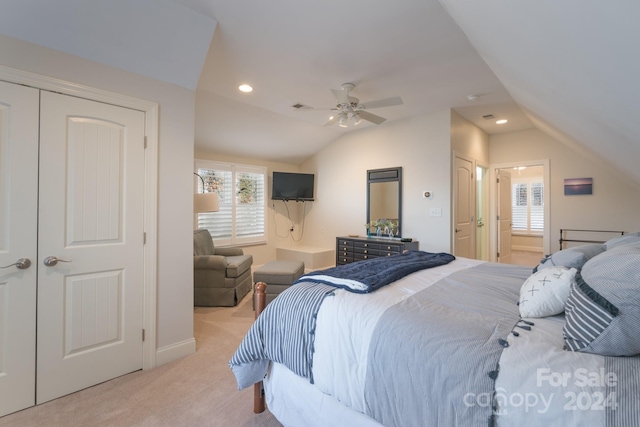 bedroom featuring ceiling fan, lofted ceiling, and light carpet