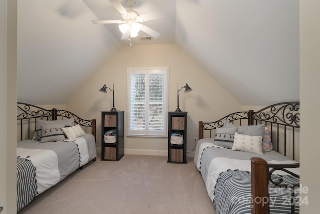 bedroom with light colored carpet, vaulted ceiling, and ceiling fan