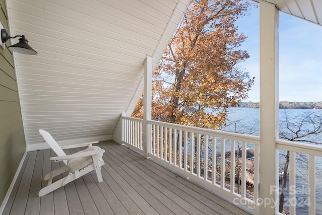 wooden deck with a water view