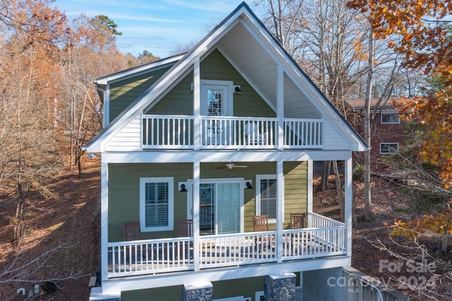 view of front of property featuring covered porch and a balcony