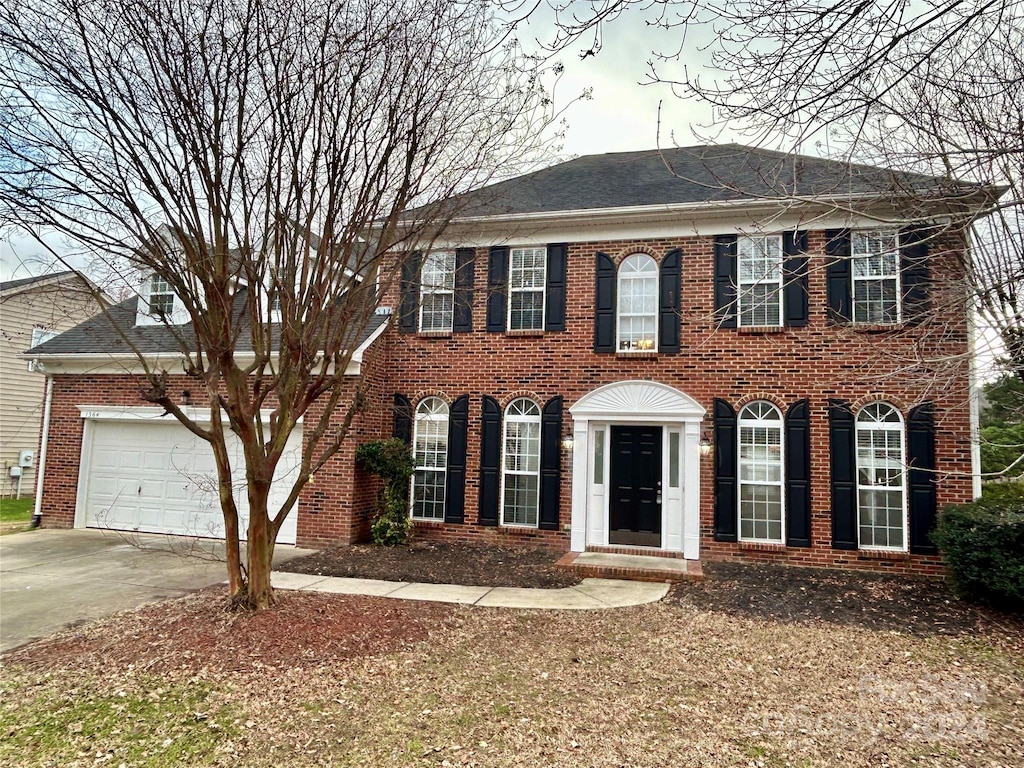 colonial home with a garage