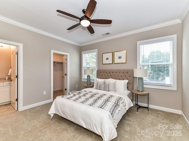 bedroom featuring multiple windows, crown molding, a spacious closet, and light colored carpet