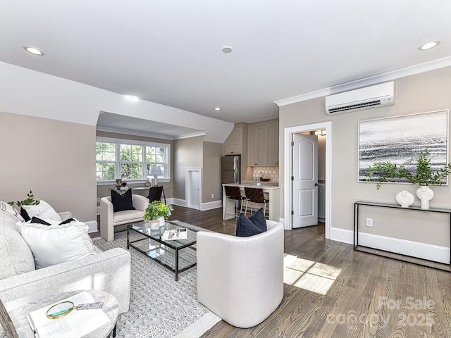 living room with crown molding, an AC wall unit, and hardwood / wood-style floors