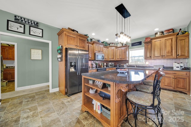 kitchen with decorative backsplash, a center island, open shelves, brown cabinets, and stainless steel appliances