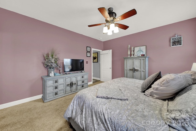 bedroom with baseboards, ceiling fan, and light colored carpet