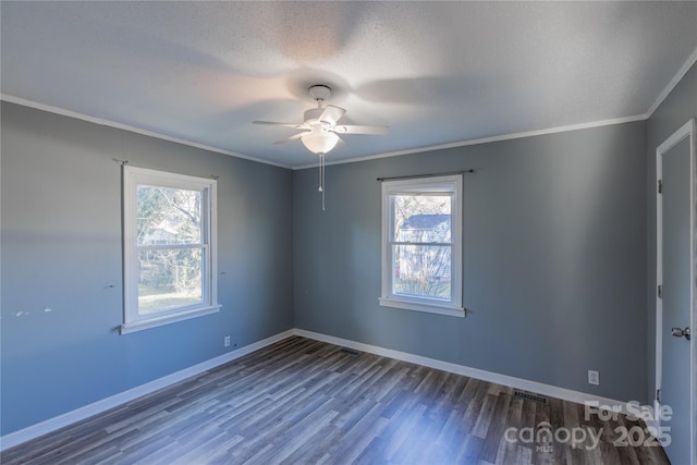 spare room featuring hardwood / wood-style floors, a textured ceiling, ceiling fan, and crown molding