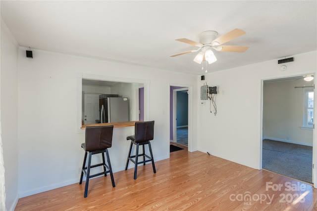 interior space with light hardwood / wood-style flooring and ceiling fan