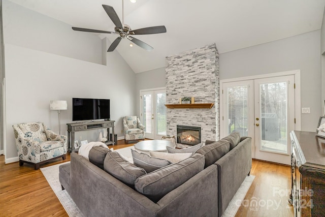 living room with ceiling fan, light hardwood / wood-style flooring, and french doors