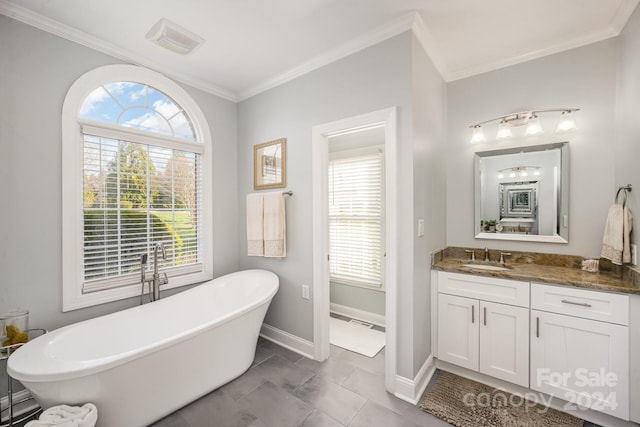 bathroom featuring crown molding, tile patterned flooring, vanity, and a bath