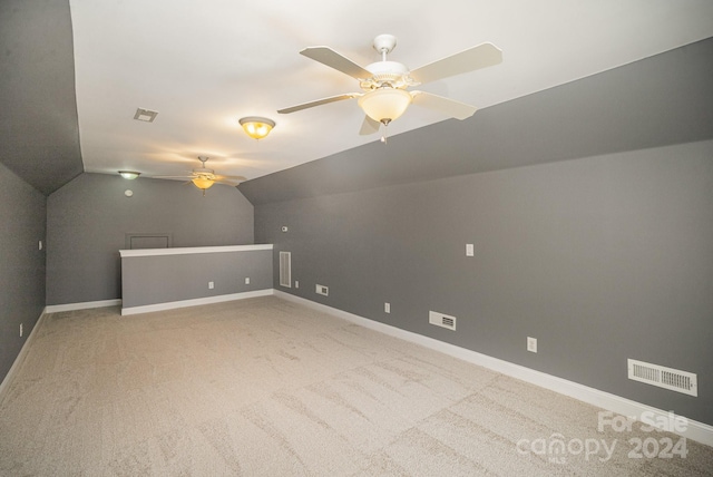 additional living space featuring carpet flooring, ceiling fan, and lofted ceiling