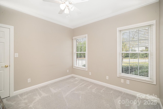 180 Sink Farm Rd, Mooresville, NC 28115 - spare room featuring carpet floors, a ceiling fan, baseboards, and crown molding