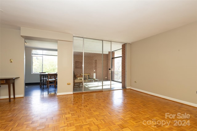 empty room with light parquet flooring