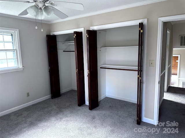 unfurnished bedroom with carpet flooring, ceiling fan, a textured ceiling, and ornamental molding