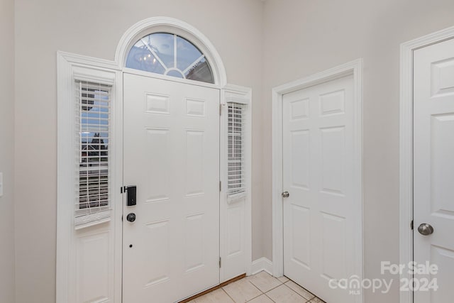 foyer with light tile patterned floors