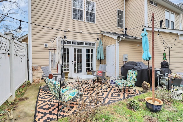 back of property featuring a patio and french doors