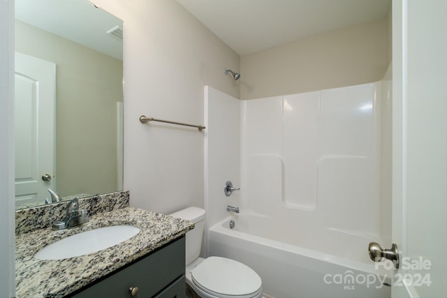 full bathroom with shower / washtub combination, vanity, and toilet