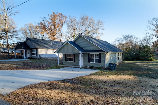 ranch-style home with a front lawn