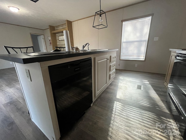 kitchen with dark hardwood / wood-style flooring, a breakfast bar, sink, pendant lighting, and black dishwasher