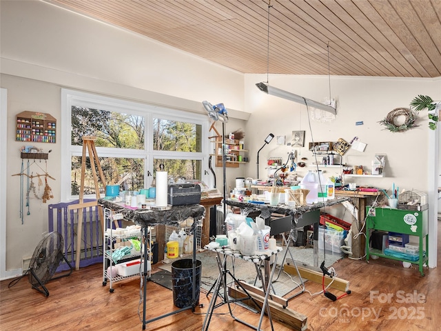 dining space with hardwood / wood-style floors and wooden ceiling