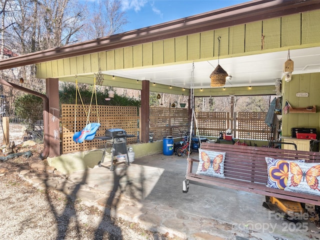 view of patio featuring a grill