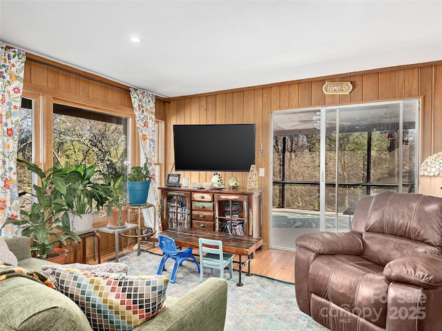 living room with wood walls