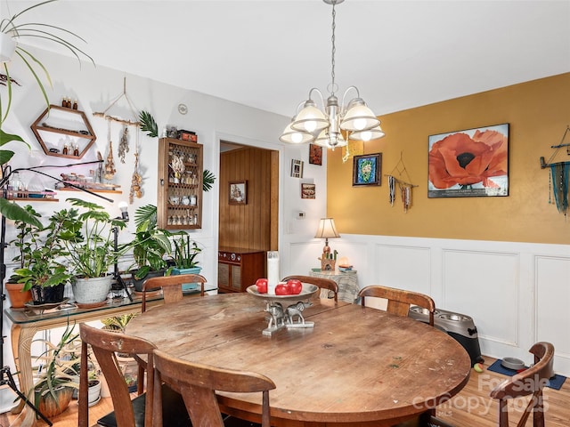 dining space featuring a chandelier and hardwood / wood-style floors