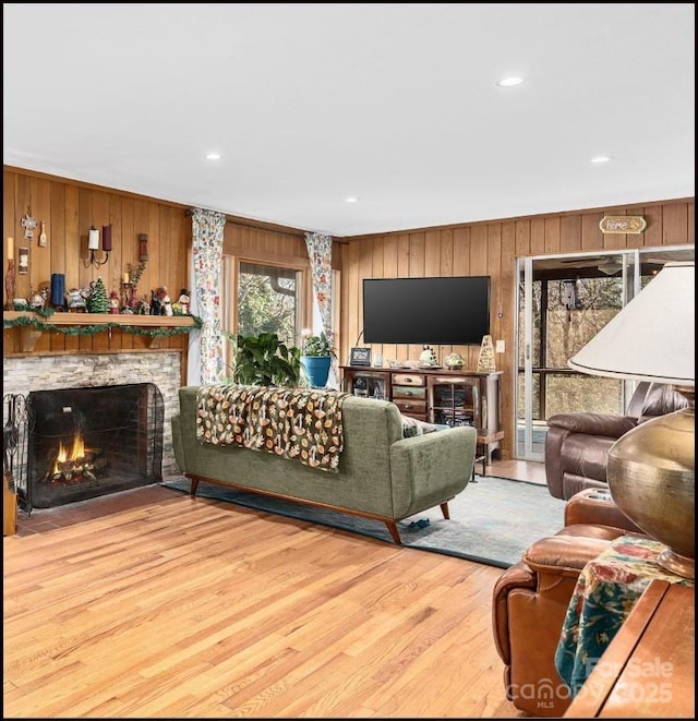 81 Jericho Dr, Tryon, NC 28782 - living area featuring wood walls, wood finished floors, a fireplace, and recessed lighting