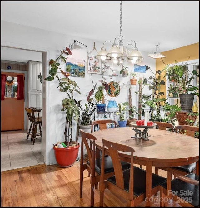 81 Jericho Dr, Tryon, NC 28782 - dining room with a chandelier and light wood-style flooring
