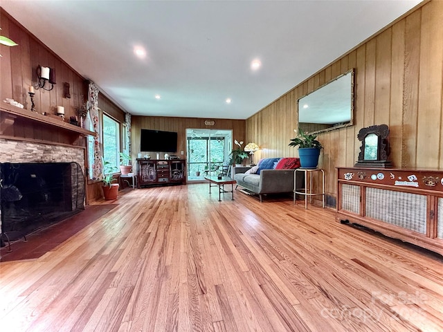 81 Jericho Dr, Tryon, NC 28782 - living room with wood finished floors, a fireplace, and wood walls