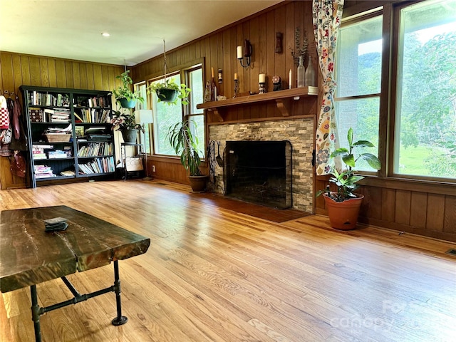 81 Jericho Dr, Tryon, NC 28782 - living area featuring wooden walls, wood finished floors, and a fireplace