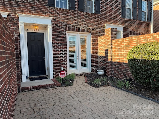 doorway to property featuring a patio area